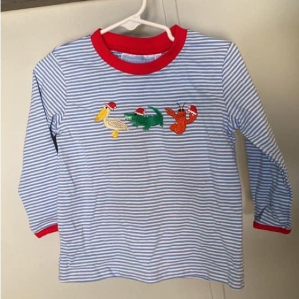 Trotter Street brand. Cajun Christmas. Never worn. 18m. Still has tags. $20